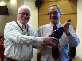 Winner of Call My Bluff, Nick Philpott receives his prize from president Bill Thomas